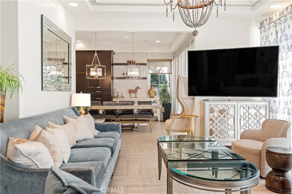 4 Peninsula Newport Coast, CA 92657 - Photo 6 of 20 a living room with furniture and a flat screen tv