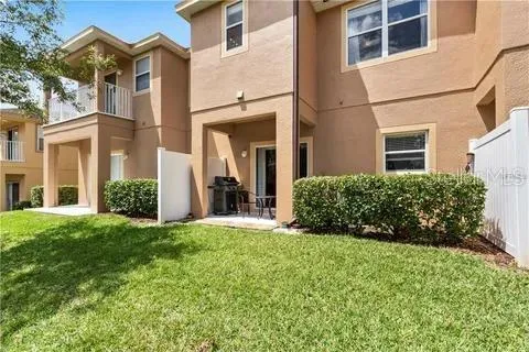 a view of a front of a house with a small yard