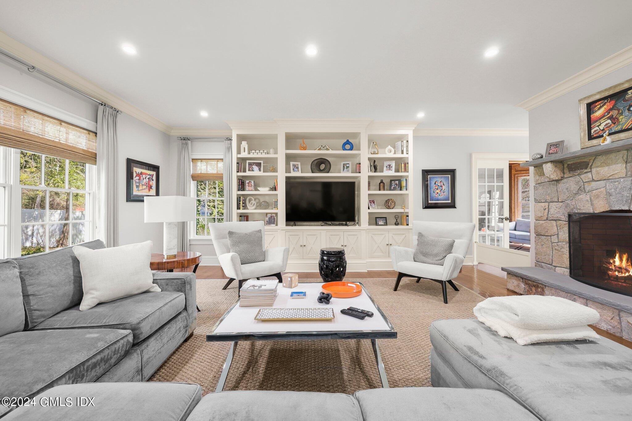 6 Coachlamp Lane Greenwich, CT 06830 - Photo 12 of 33 a living room with furniture fireplace and flat screen tv