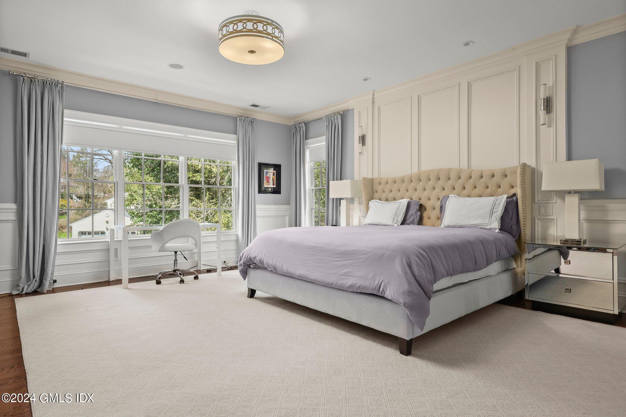 6 Coachlamp Lane Greenwich, CT 06830 - Photo 16 of 33 a spacious bedroom with a bed and a large window