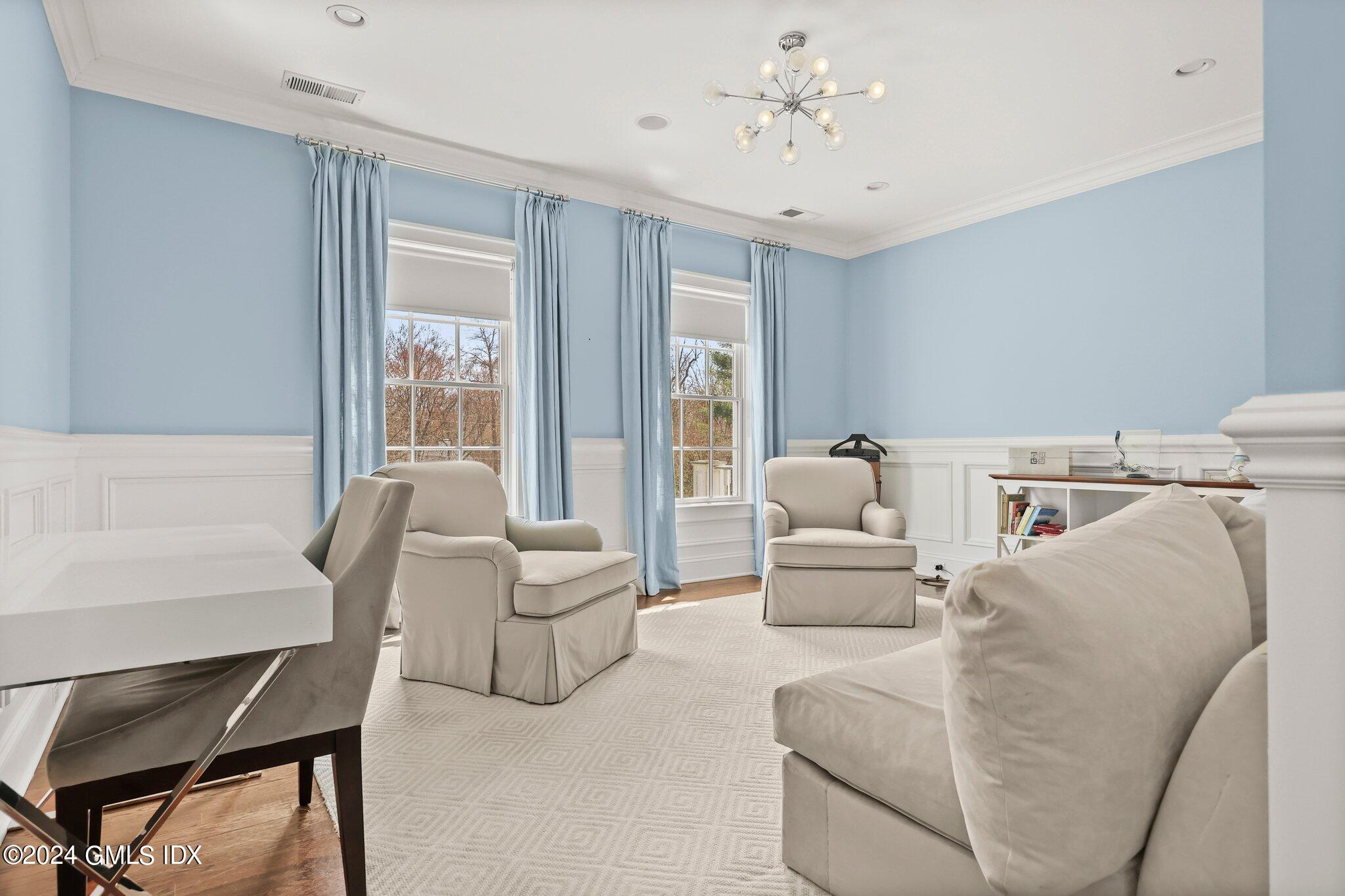 6 Coachlamp Lane Greenwich, CT 06830 - Photo 17 of 33 a living room with furniture and a large window