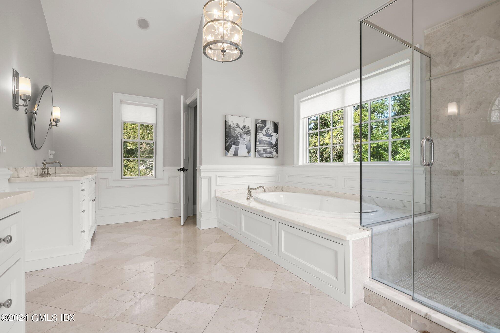 6 Coachlamp Lane Greenwich, CT 06830 - Photo 18 of 33 a spacious bathroom with a tub sink and mirror