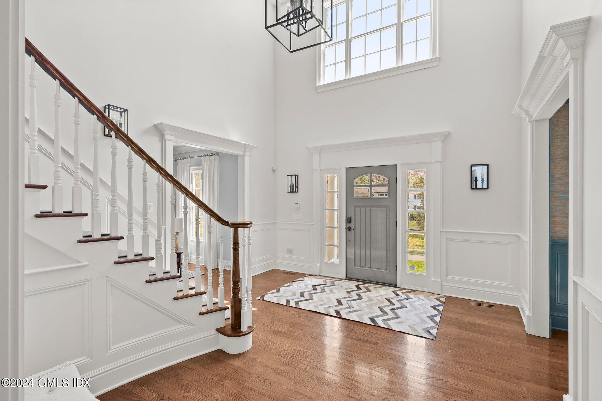 6 Coachlamp Lane Greenwich, CT 06830 - Photo 2 of 33 a view of an entryway with wooden floor