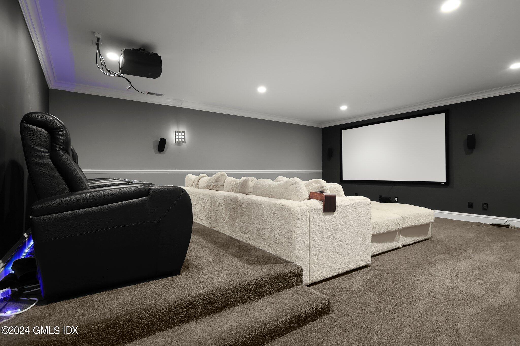 6 Coachlamp Lane Greenwich, CT 06830 - Photo 26 of 33 a living room with furniture and a flat screen tv