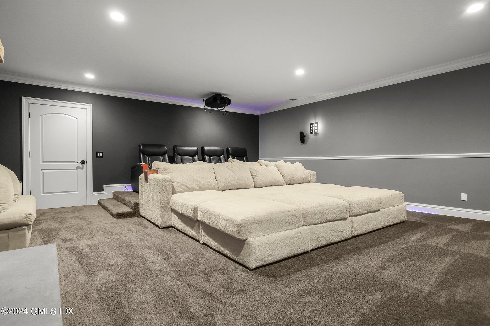 6 Coachlamp Lane Greenwich, CT 06830 - Photo 27 of 33 a spacious bedroom with a bed and a couch