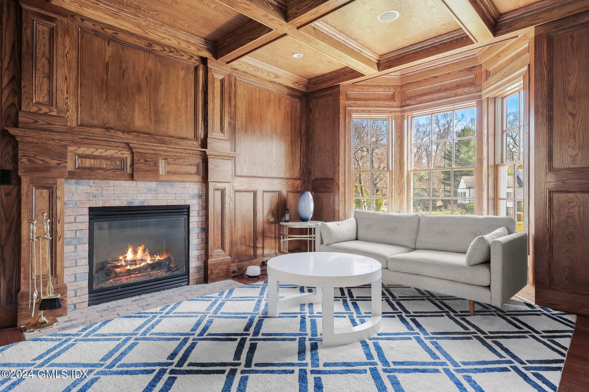 6 Coachlamp Lane Greenwich, CT 06830 - Photo 6 of 33 a living room with furniture and a fireplace