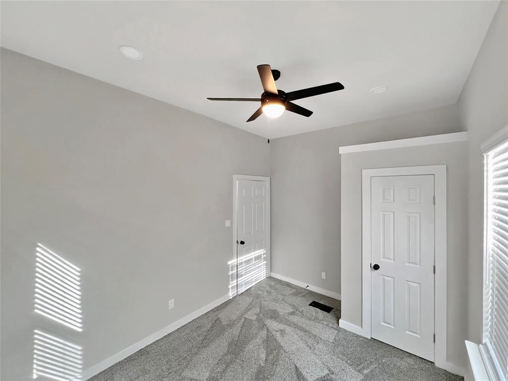 5530 Reiger Avenue, Unit 5528 Dallas, TX 75214 - Photo 15 of 40 a view of room with chandelier fan and windows