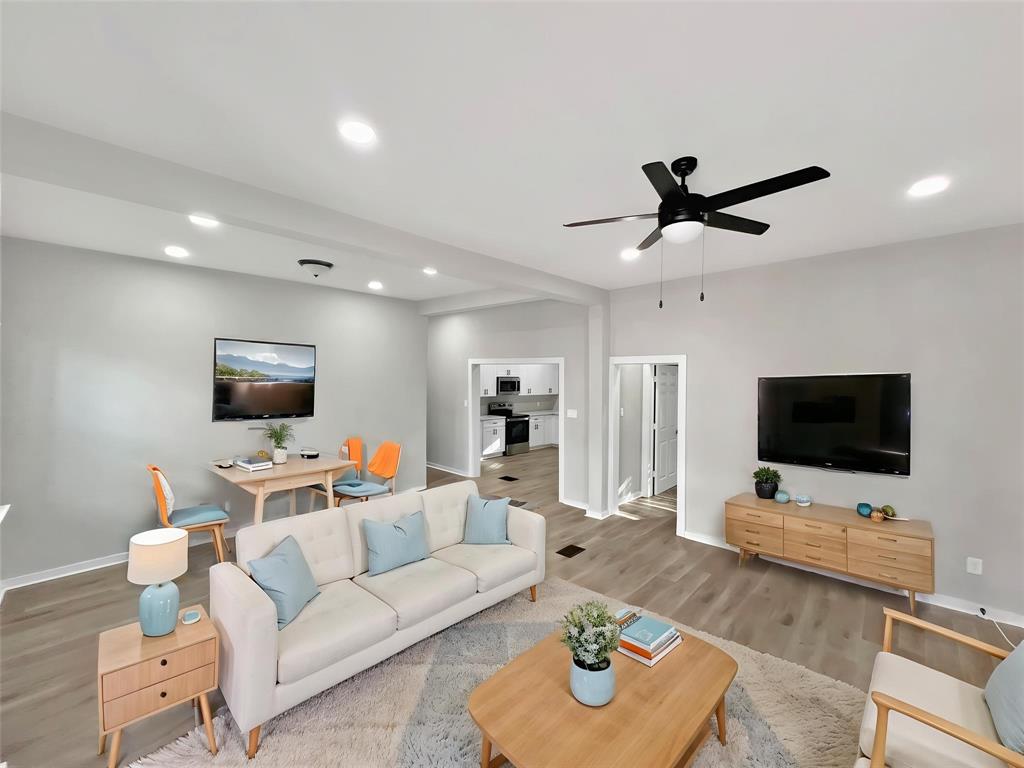 5530 Reiger Avenue, Unit 5528 Dallas, TX 75214 - Photo 2 of 40 a living room with furniture and a flat screen tv
