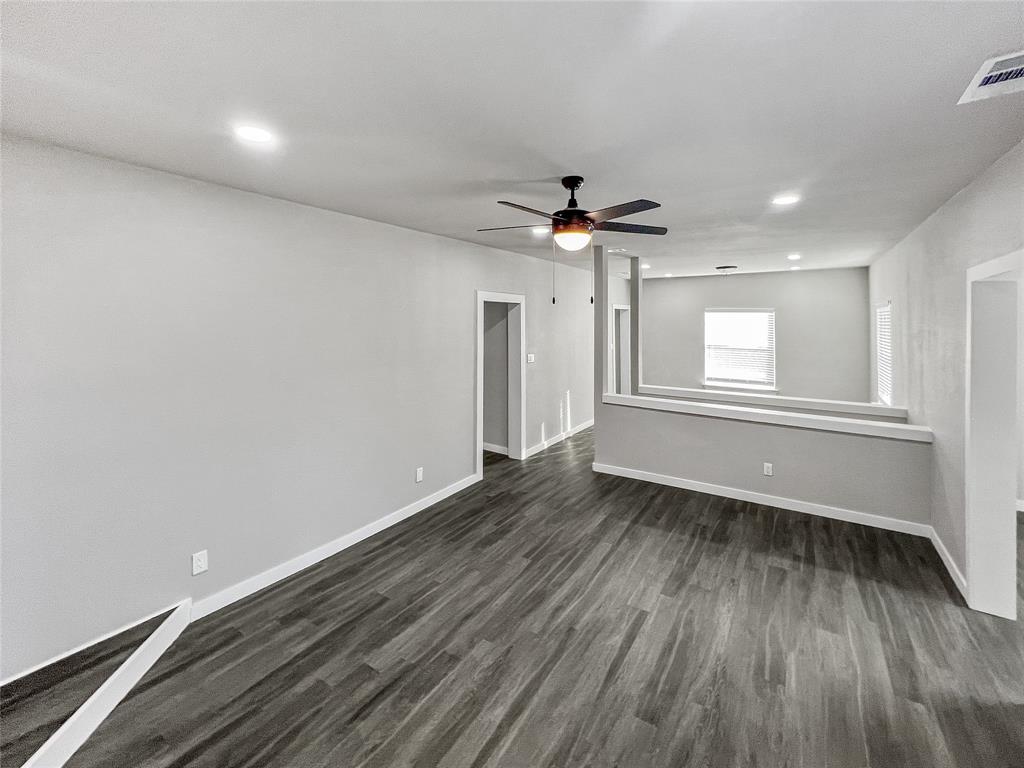 5530 Reiger Avenue, Unit 5528 Dallas, TX 75214 - Photo 22 of 40 wooden floor in an empty room with a window