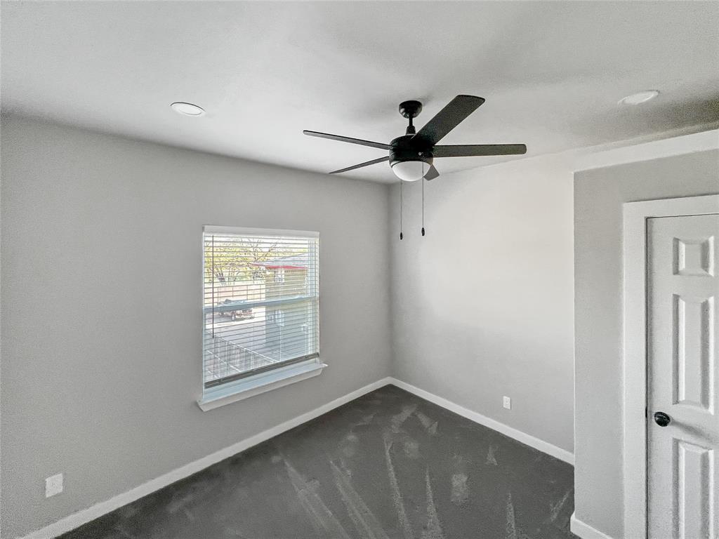 5530 Reiger Avenue, Unit 5528 Dallas, TX 75214 - Photo 26 of 40 a view of a big room with wooden floor and a window