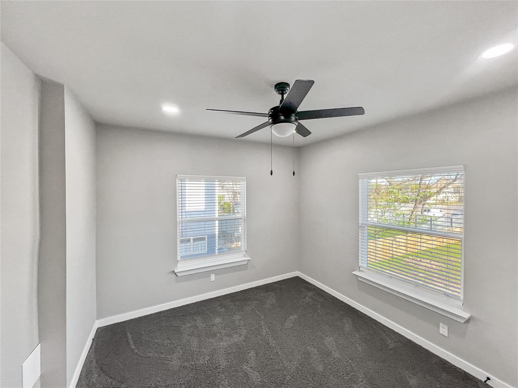 5530 Reiger Avenue, Unit 5528 Dallas, TX 75214 - Photo 30 of 40 a view of a livingroom with a ceiling fan and window