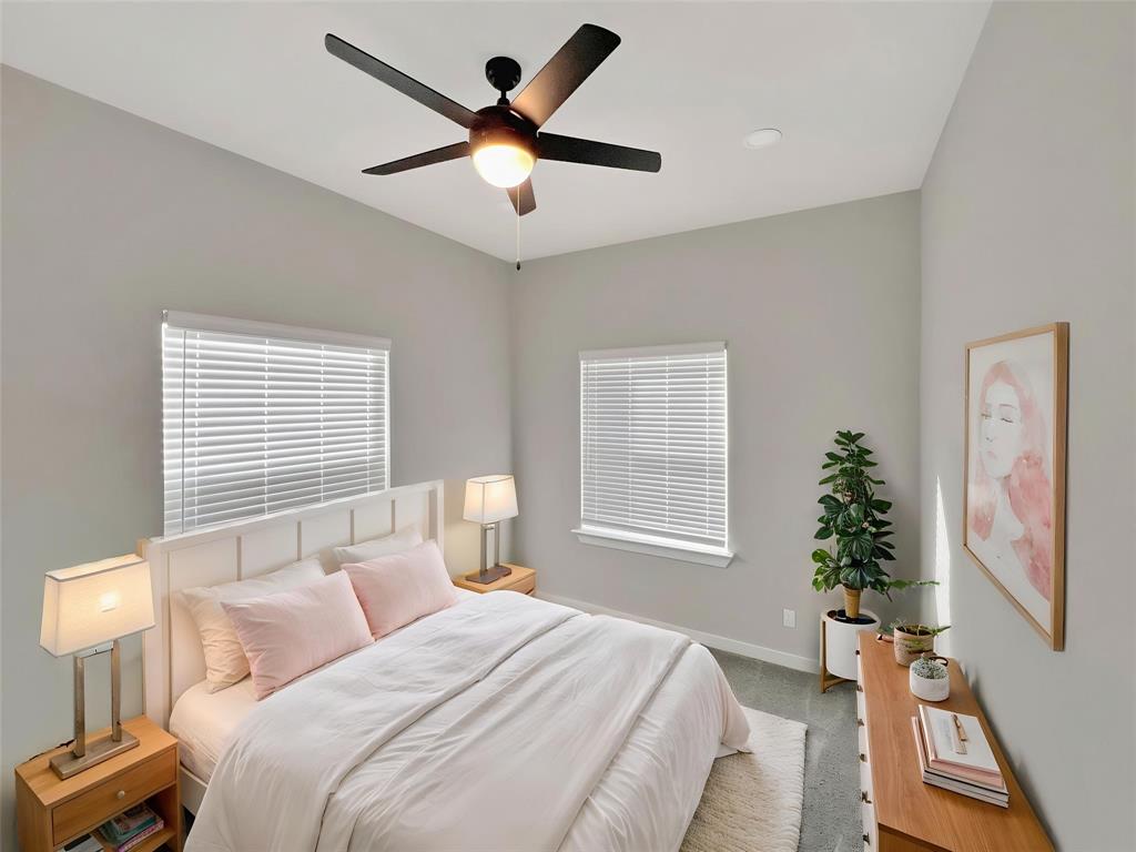 5530 Reiger Avenue, Unit 5528 Dallas, TX 75214 - Photo 3 of 40 a bedroom with a large bed chandelier and a window