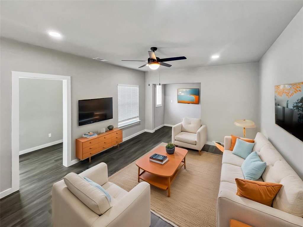 5530 Reiger Avenue, Unit 5528 Dallas, TX 75214 - Photo 5 of 40 a living room with furniture and a flat screen tv