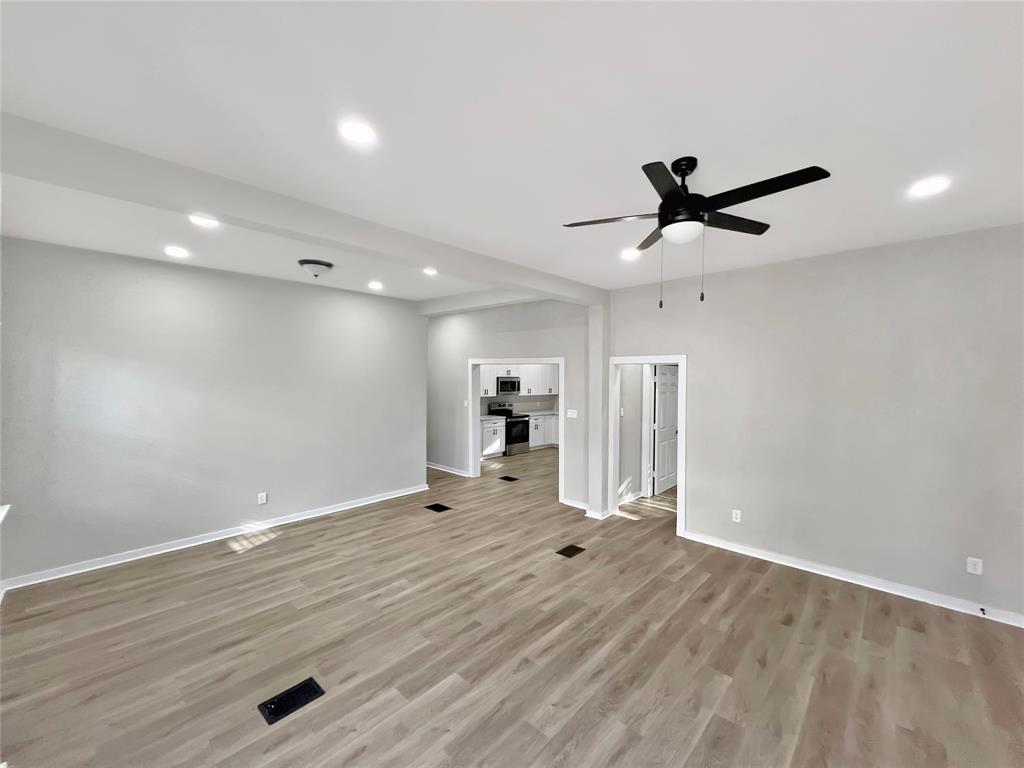 5530 Reiger Avenue, Unit 5528 Dallas, TX 75214 - Photo 8 of 40 a view of a kitchen with a sink and a refrigerator