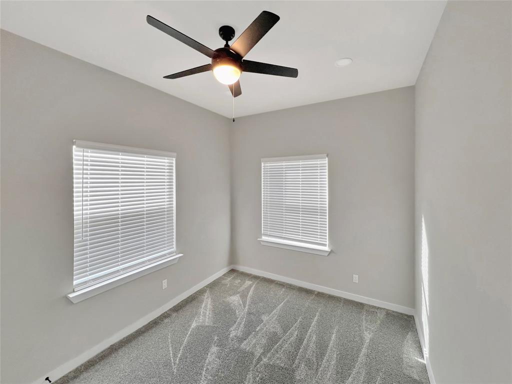 5530 Reiger Avenue, Unit 5528 Dallas, TX 75214 - Photo 9 of 40 a view of an empty room with a window