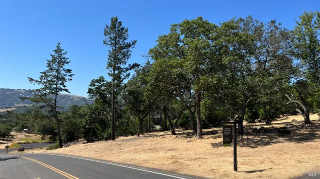 a view of a parking space with sign board