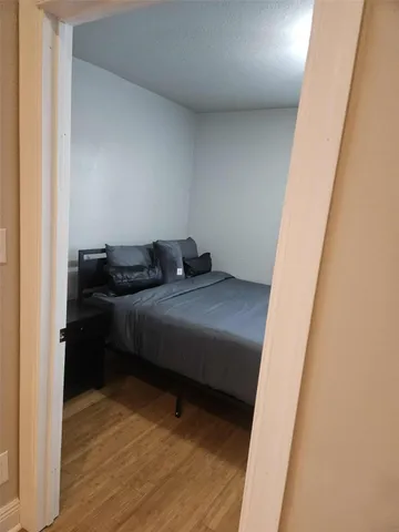 a bathroom with a granite countertop sink a mirror and vanity