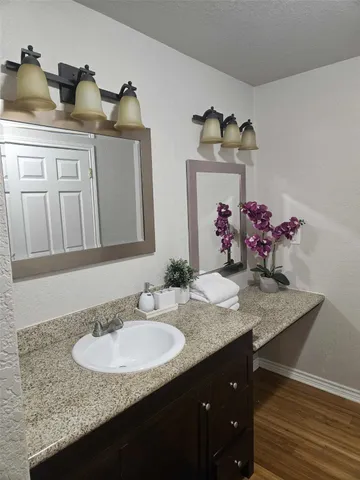 a bedroom with a bed and a table