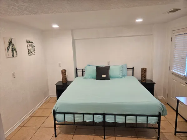 a room with a sink and cabinets