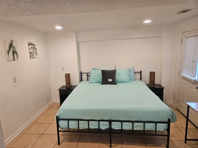 a room with a sink and cabinets