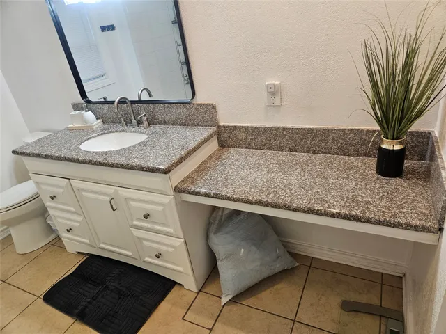 a spacious bathroom with a double vanity sink mirror and