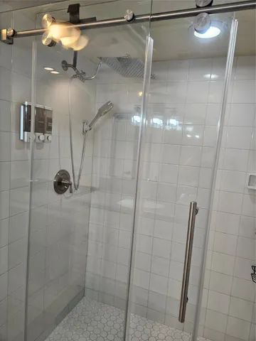 a view of a dining room with tables and chairs