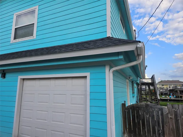 a balcony with wooden floor and city view