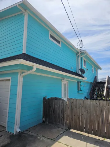 a balcony with wooden floor and city view