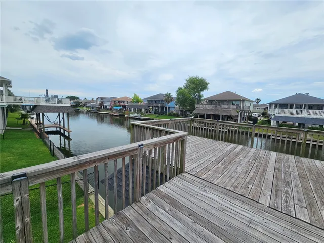 a kitchen with stainless steel appliances kitchen island granite countertop a stove and a refrigerator