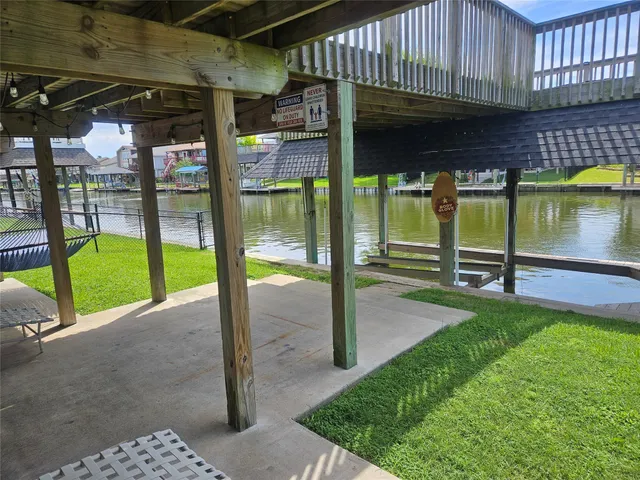 a view of a house with wooden deck