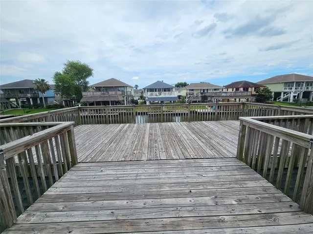 a bedroom with furniture and a wooden floor