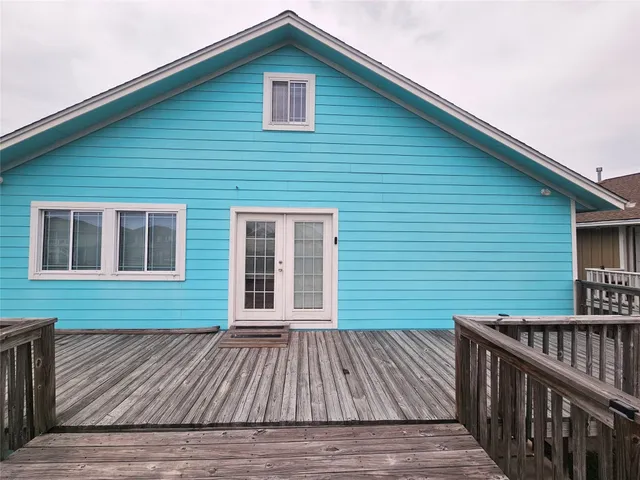 a room with a bed and a mirror