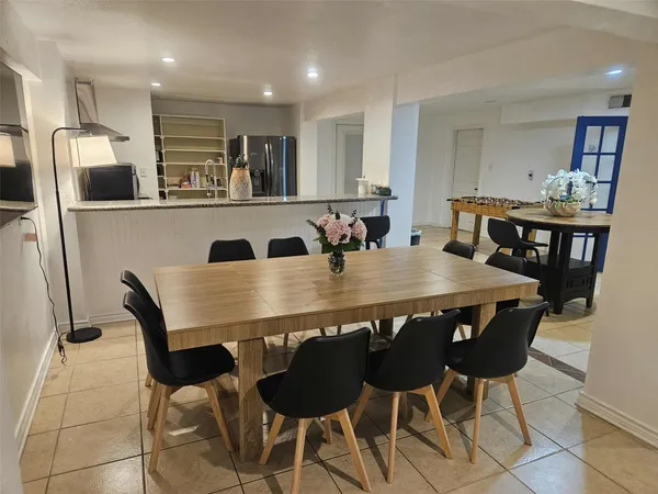 a kitchen with stainless steel appliances granite countertop a sink and a stove