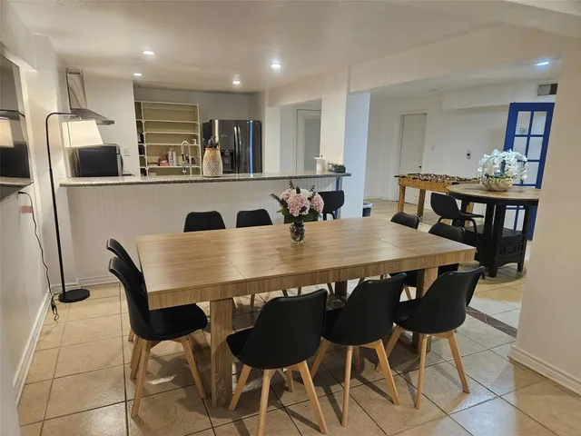 a kitchen with stainless steel appliances granite countertop a sink and a stove
