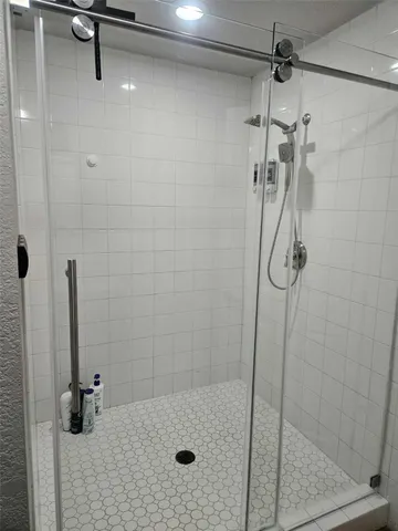 a bathroom with a sink and a shower