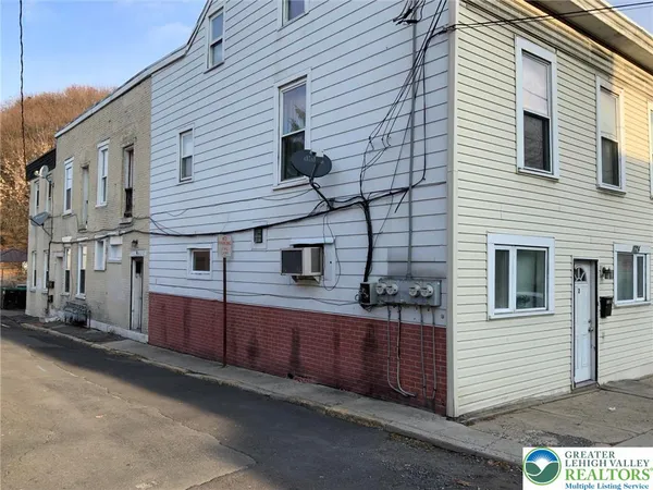 a view of a house with a street