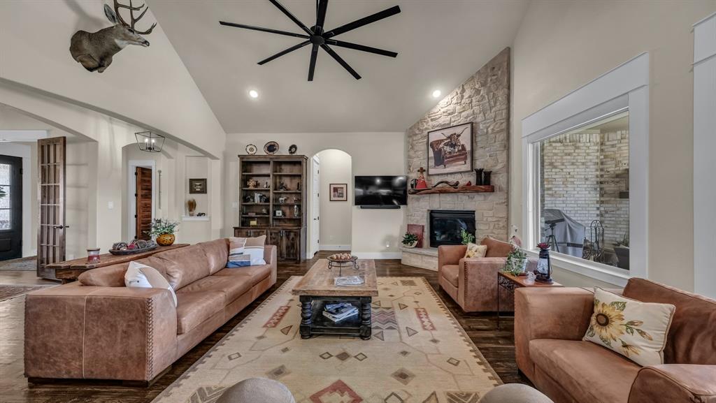 1320 Post Oak Road Gordon, TX 76453 - Photo 13 of 40 a living room with furniture and a fireplace