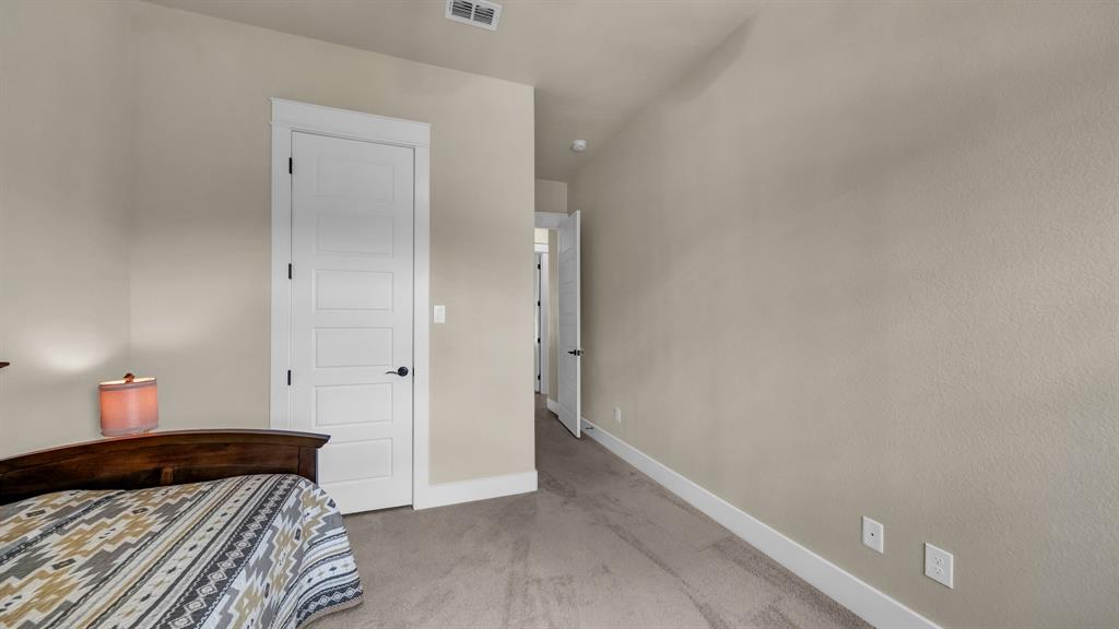 1320 Post Oak Road Gordon, TX 76453 - Photo 29 of 40 a bedroom with a bed and a cabinets