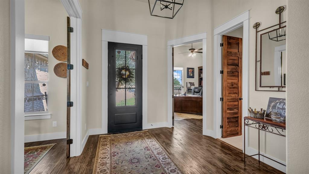 1320 Post Oak Road Gordon, TX 76453 - Photo 3 of 40 a view of a hallway with wooden floor and windows