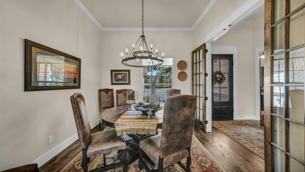 1320 Post Oak Road Gordon, TX 76453 - Photo 8 of 40 a view of a dining room with furniture and chandelier