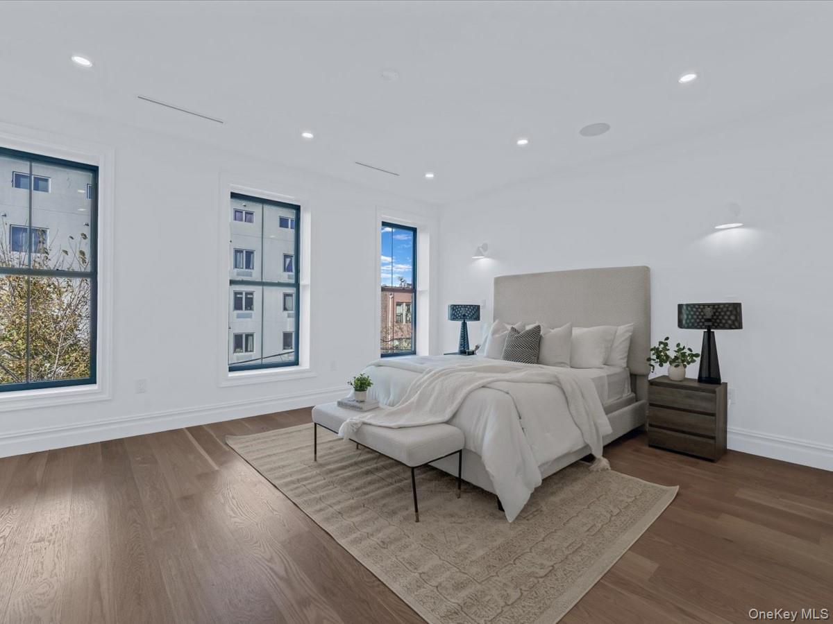 753 Hancock Street, Unit HSE Brooklyn, NY 11233 - Photo 11 of 46 a spacious bedroom with a bed and a window