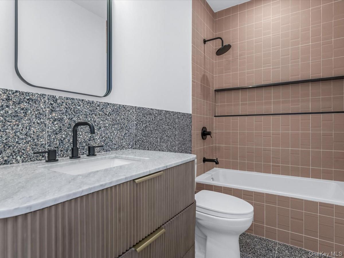 753 Hancock Street, Unit HSE Brooklyn, NY 11233 - Photo 21 of 46 a bathroom with a sink a toilet and shower