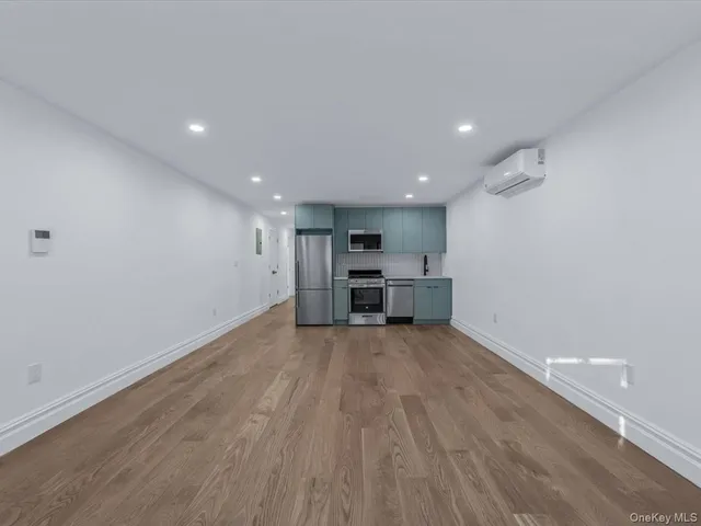 a view of kitchen and wooden floor