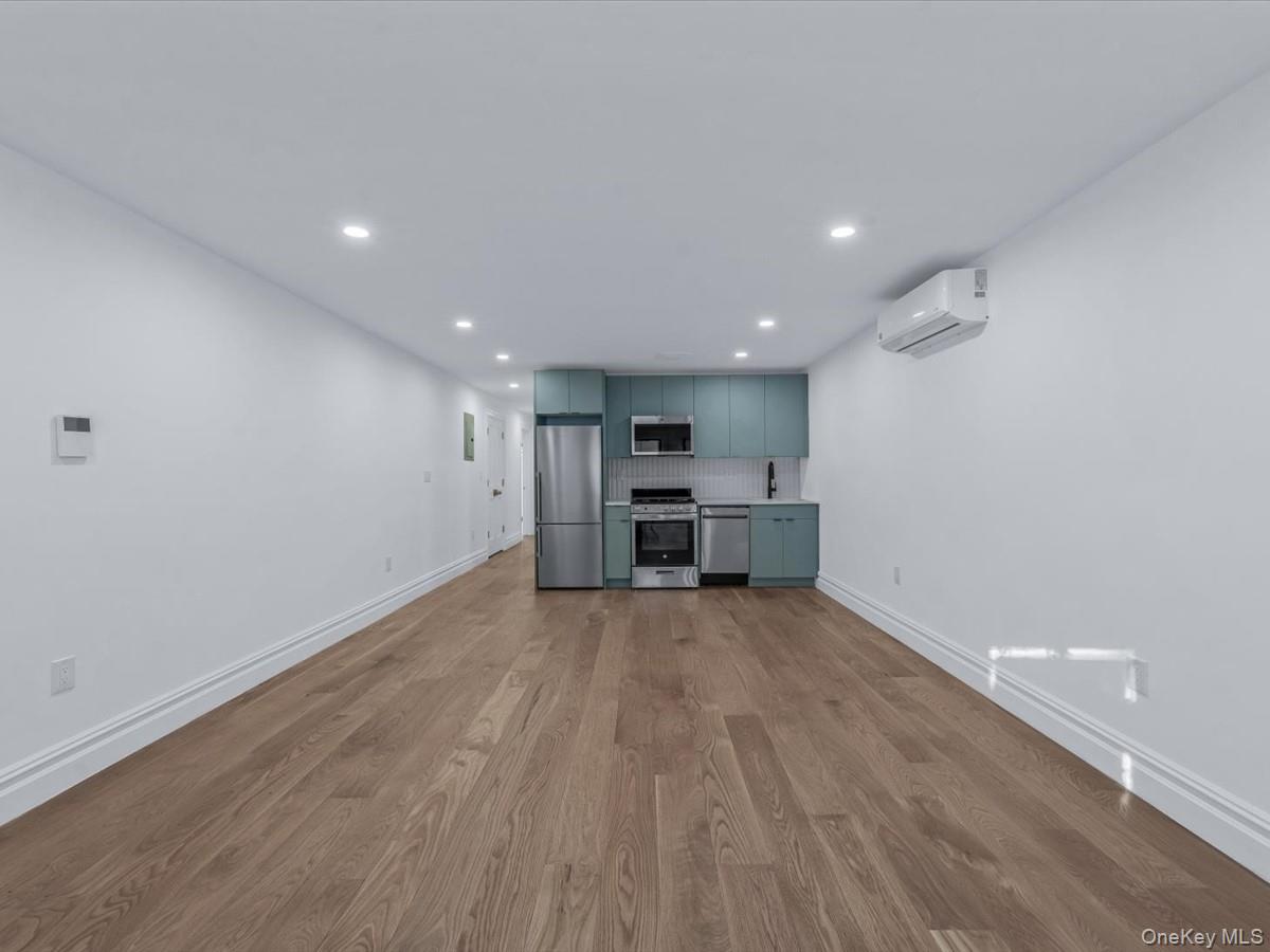 753 Hancock Street, Unit HSE Brooklyn, NY 11233 - Photo 25 of 46 a view of kitchen and wooden floor