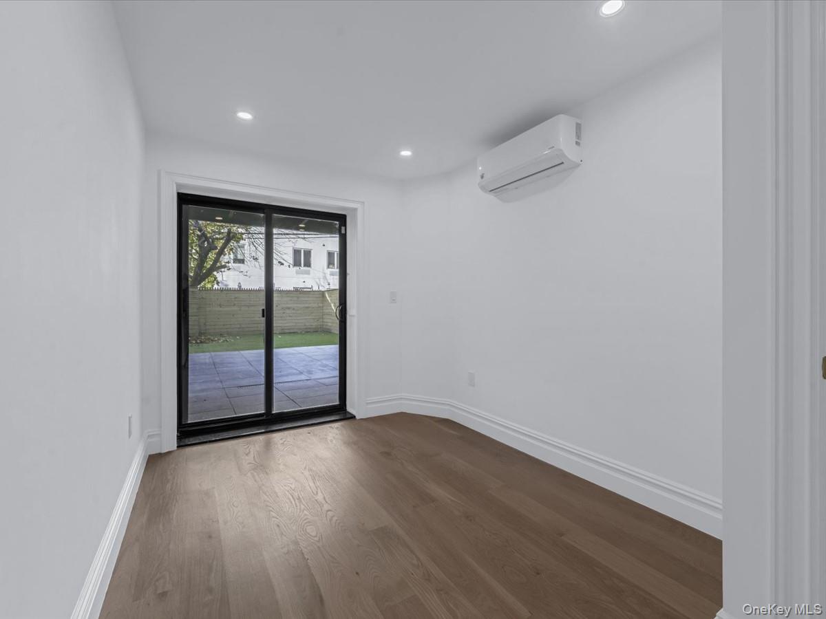 753 Hancock Street, Unit HSE Brooklyn, NY 11233 - Photo 31 of 46 wooden floor in an empty room with a window