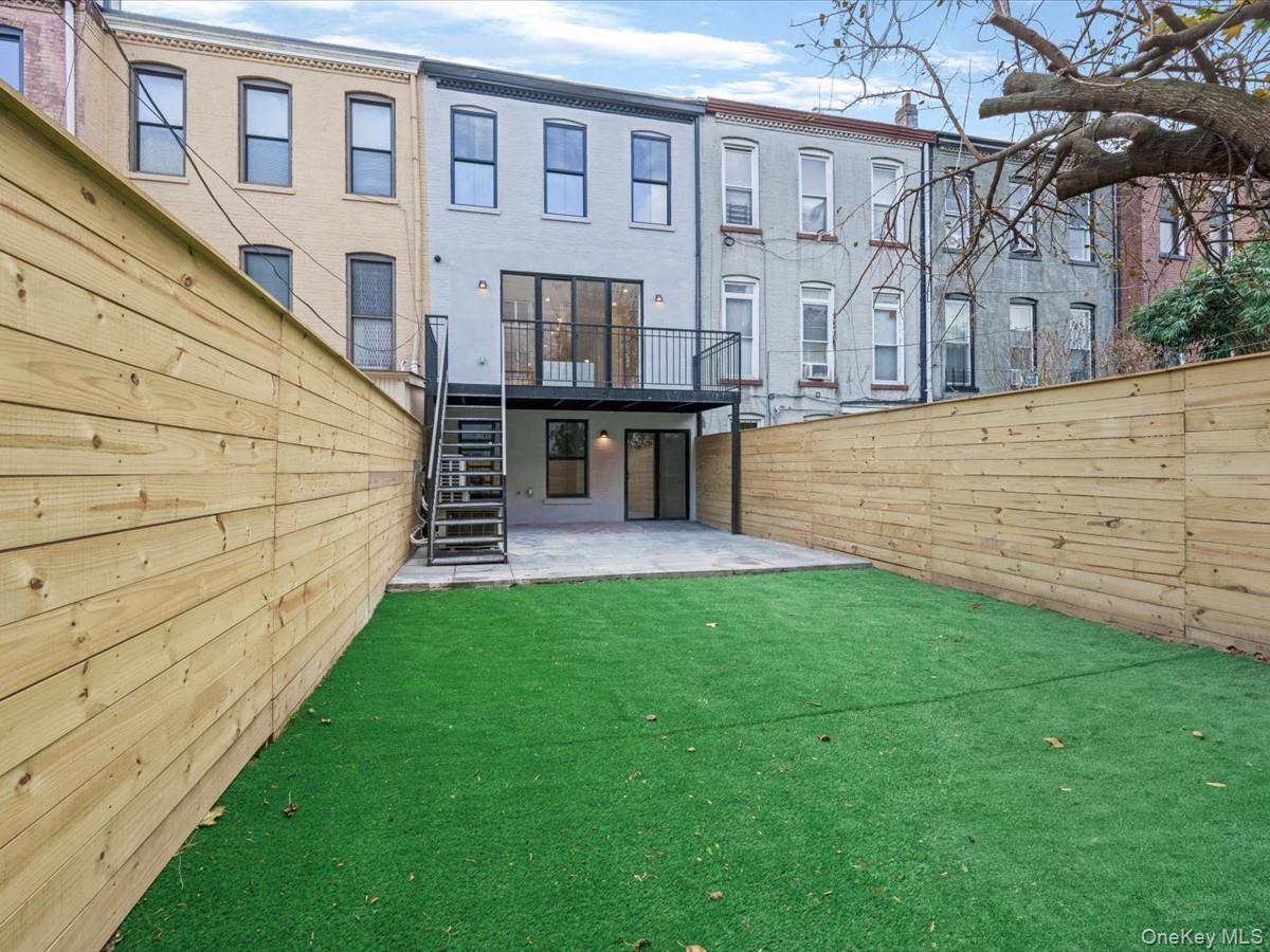 753 Hancock Street, Unit HSE Brooklyn, NY 11233 - Photo 38 of 46 a view of a house with a yard