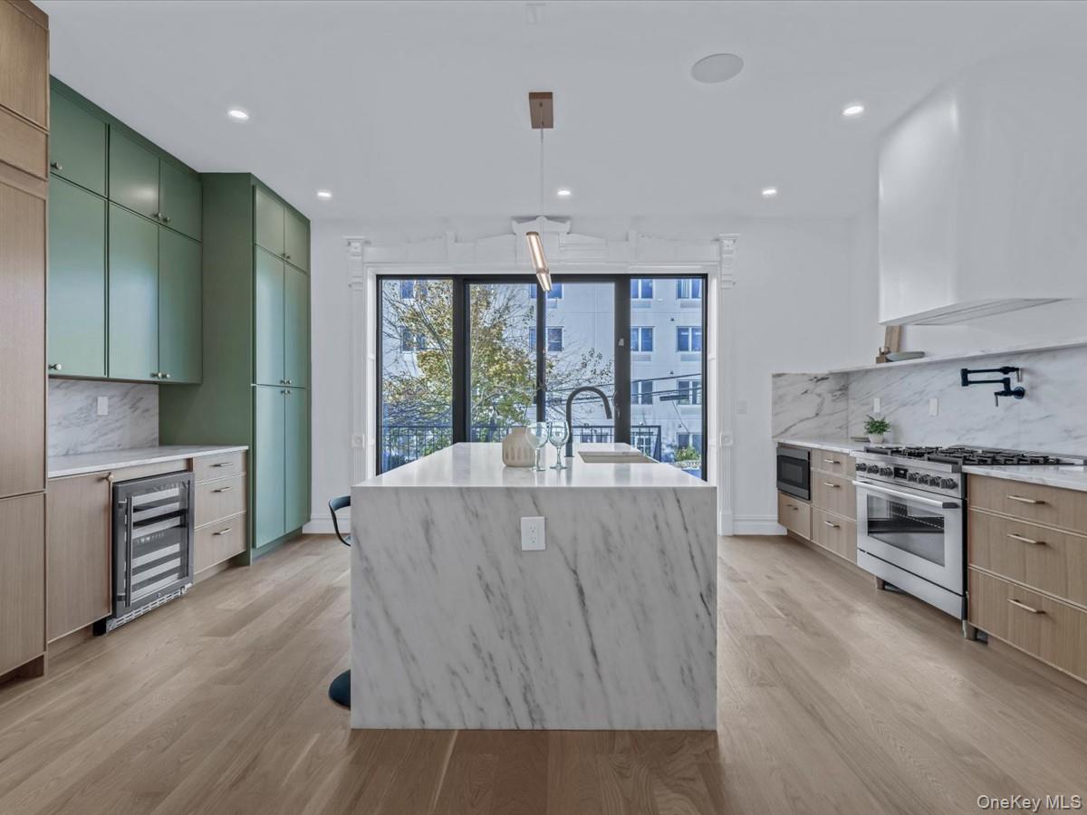 753 Hancock Street, Unit HSE Brooklyn, NY 11233 - Photo 5 of 46 a living room with stainless steel appliances granite countertop furniture and a wooden floor