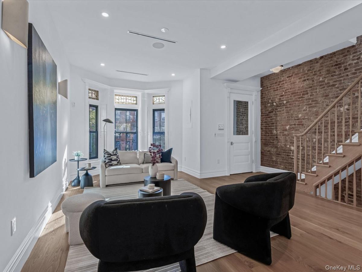 753 Hancock Street, Unit HSE Brooklyn, NY 11233 - Photo 7 of 46 a living room with furniture and large windows