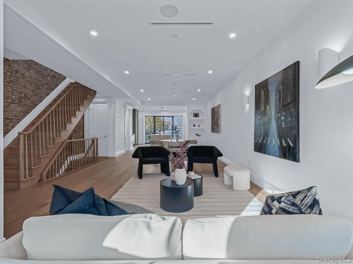 753 Hancock Street, Unit HSE Brooklyn, NY 11233 - Photo 8 of 46 a living room with furniture a dining table and white walls