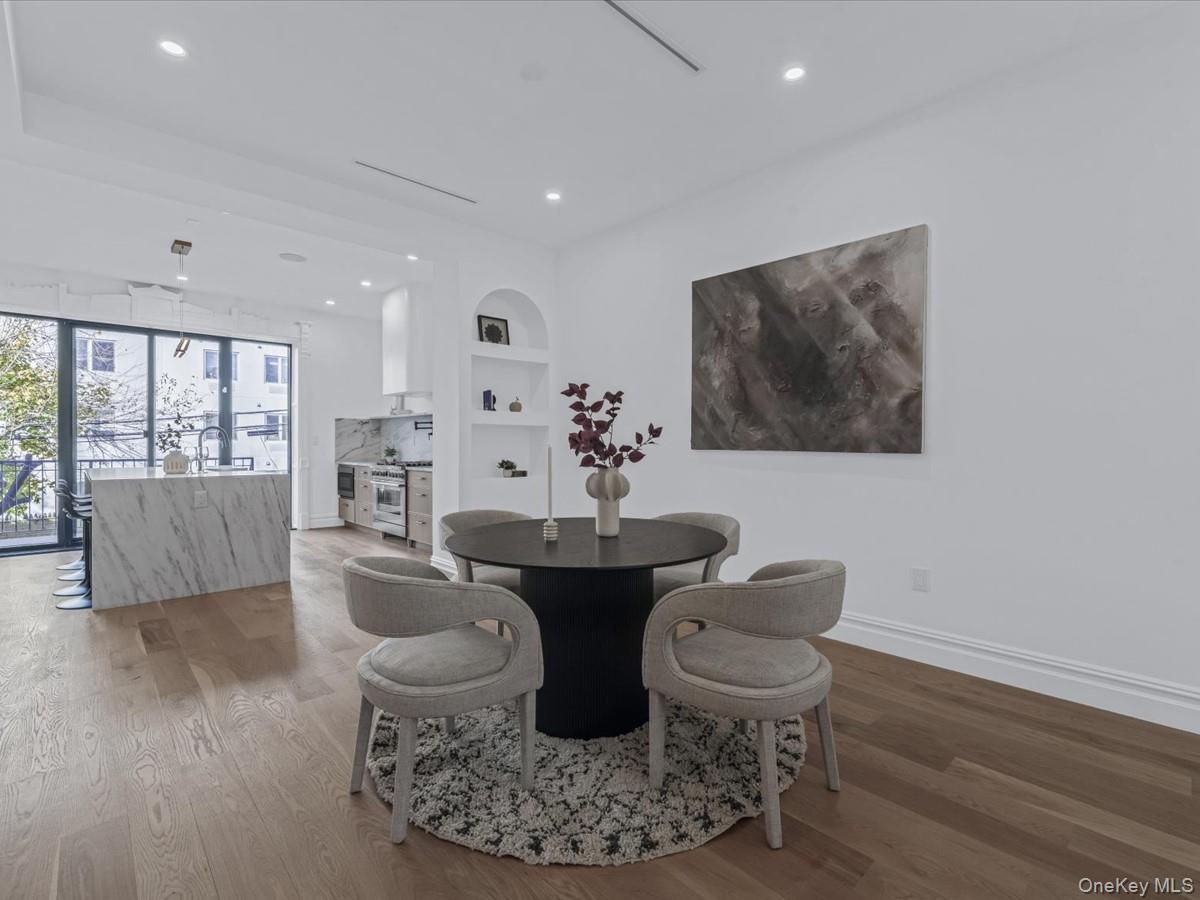 753 Hancock Street, Unit HSE Brooklyn, NY 11233 - Photo 9 of 46 a dining room with furniture and wooden floor